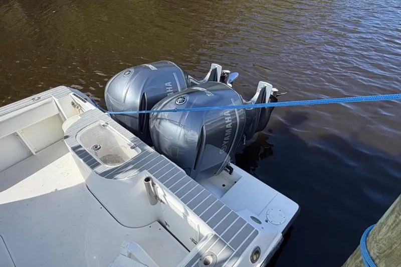 Slide: The Image of 2006 Contender 35 Side Console with twin Yamaha outboard motors docked on water. - 4