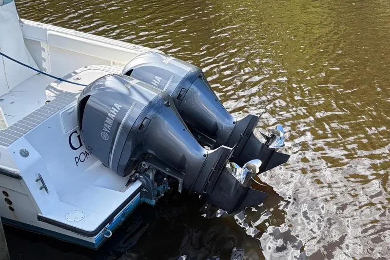 Slide: The Image of 2006 Contender 35 Side Console with twin Yamaha outboard motors on water. - 6