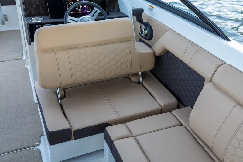 Slide: The Image of Manufacturer Provided Image: 2019 Sea Ray SDX 270 boat interior seating with beige upholstery. - 13