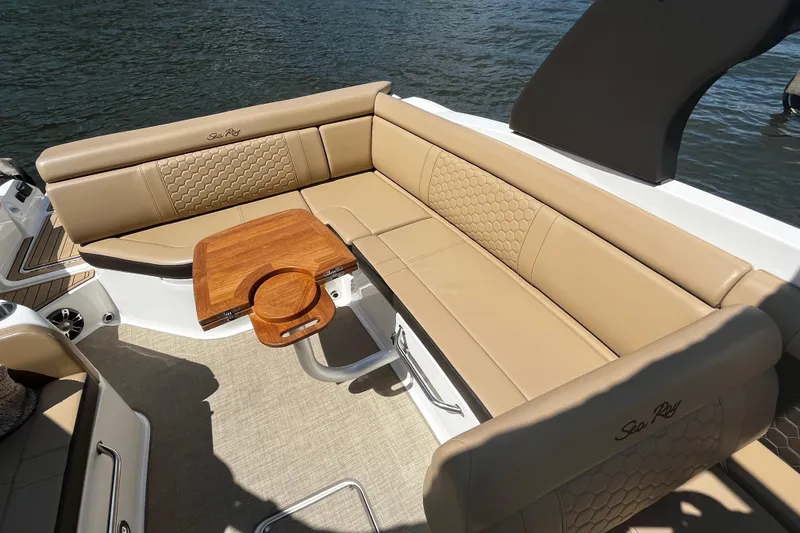 Slide: The Image of Luxurious seating area on 2019 Sea Ray SDX 270 boat with wooden table. - 20
