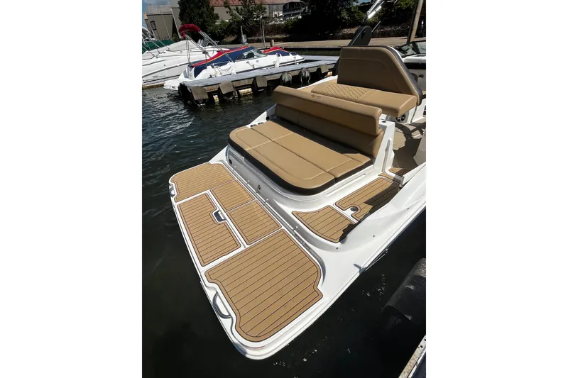 Slide: The Image of 2019 Sea Ray SDX 270 boat with tan seating and teak-style swim platform. - 5