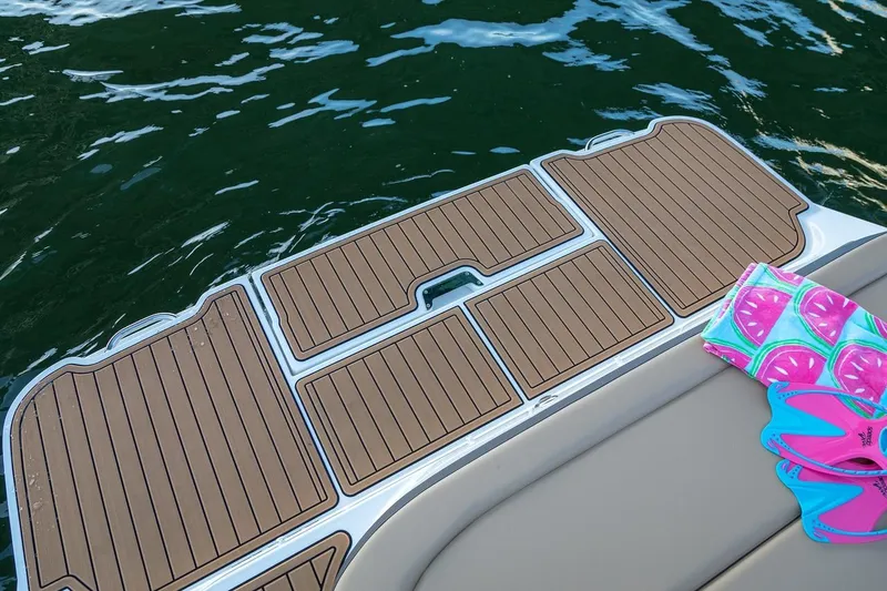 Slide: The Image of Manufacturer Provided Image: 2019 Sea Ray SDX 270 boat interior with tan seating and modern dashboard. - 7