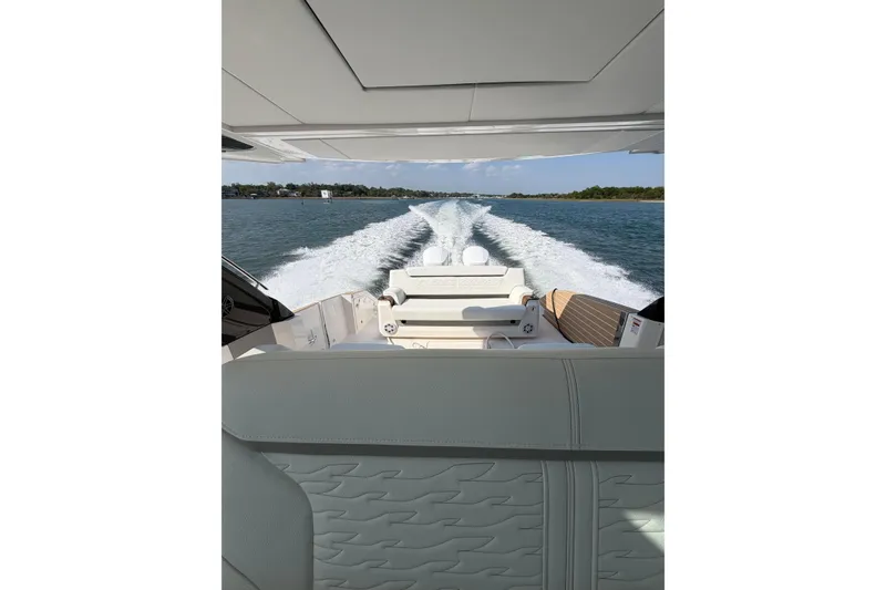 Slide: The Image of 2026 Tiara Yachts 39 LS cruising on open water, view from the deck. - 4