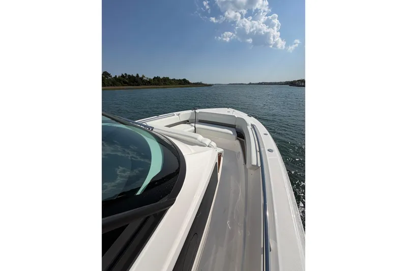 Slide: The Image of 2026 Tiara Yachts 39 LS cruising on a sunny day, showcasing sleek design and open water. - 6