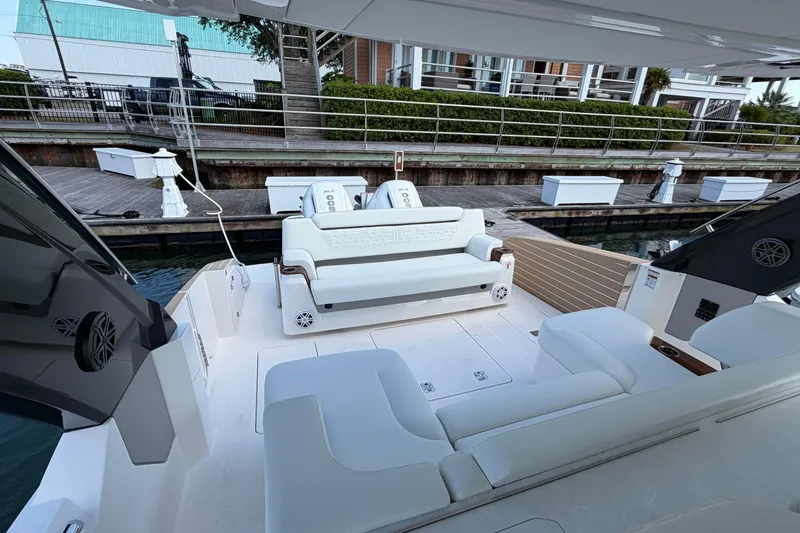 Slide: The Image of Luxurious seating area on a 2026 Tiara Yachts 39 LS, docked by the water. - 7