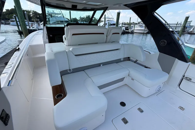 Slide: The Image of Luxurious seating area on 2026 Tiara Yachts 39 LS, docked at marina. - 8