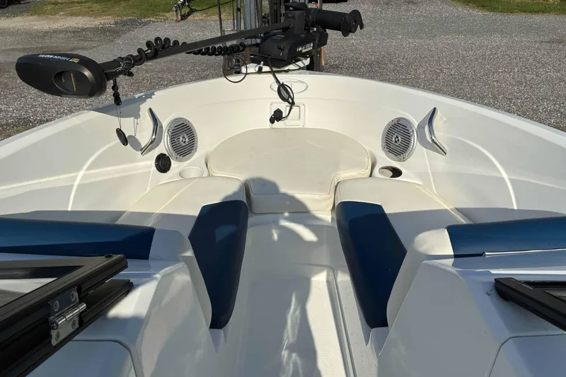 Slide: The Image of Interior view of a 2021 Tahoe 500 TF boat, featuring seating and audio speakers. - 2