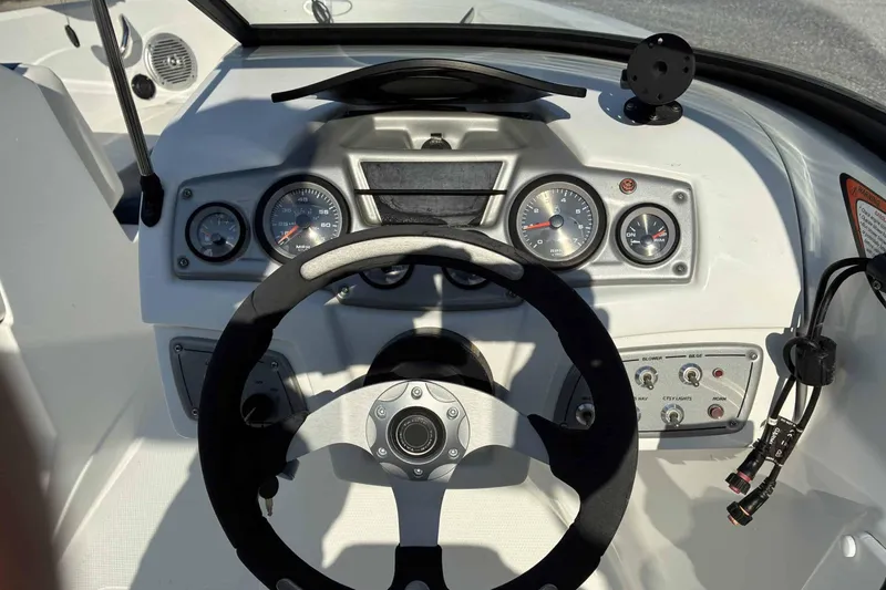 Slide: The Image of Steering console of a 2021 Tahoe 500 TF boat with gauges and controls. - 4