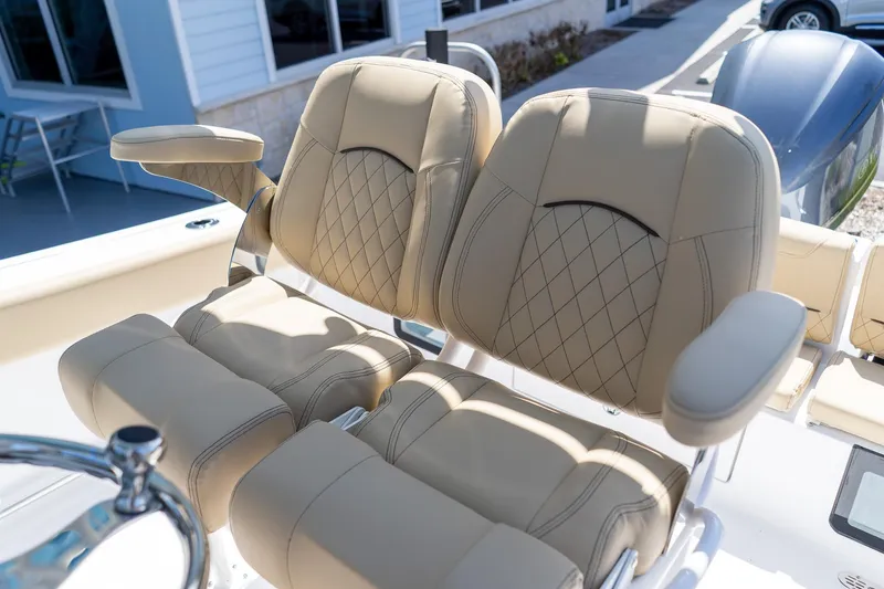 Slide: The Image of Luxurious seating on 2026 Sportsman Heritage 231 Center Console boat, featuring diamond-stitched upholstery. - 18