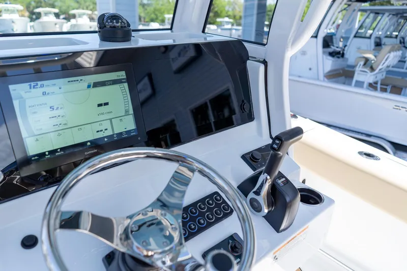Slide: The Image of 2026 Sportsman Heritage 231 Center Console dashboard with touchscreen and steering wheel. - 19