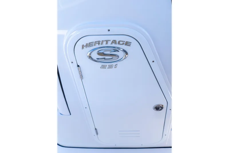 Slide: The Image of 2026 Sportsman Heritage 231 Center Console boat emblem on white surface. - 20
