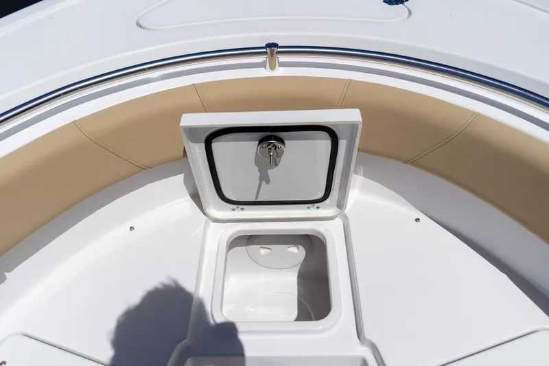 Slide: The Image of 2026 Sportsman Heritage 231 Center Console boat with open storage compartment. - 26