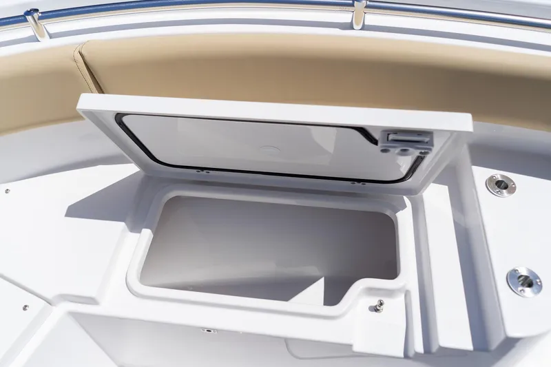 Slide: The Image of Open storage compartment on 2026 Sportsman Heritage 231 Center Console boat. - 27