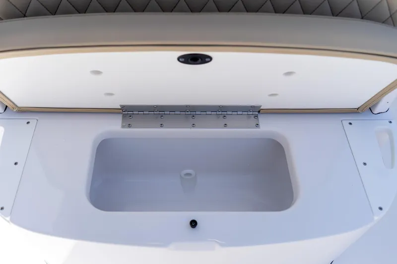 Slide: The Image of 2026 Sportsman Heritage 231 Center Console storage compartment with open lid and sleek design. - 31