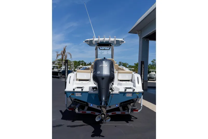 Slide: The Image of 2026 Sportsman Heritage 231 Center Console boat with powerful outboard motor. - 35