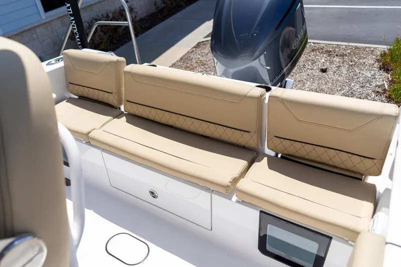 Slide: The Image of 2026 Sportsman Heritage 231 Center Console boat with beige cushioned seating and Yamaha engine. - 42