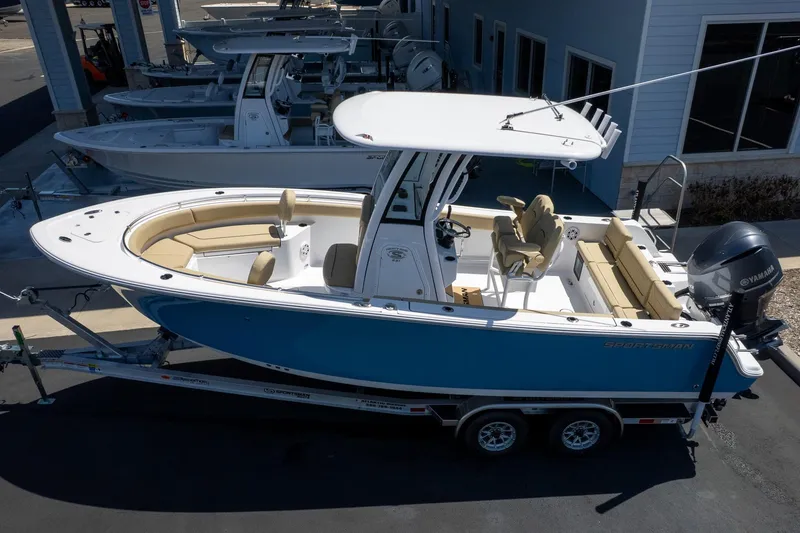 Slide: The Image of 2026 Sportsman Heritage 231 Center Console boat on trailer, featuring sleek design and spacious seating. - 5