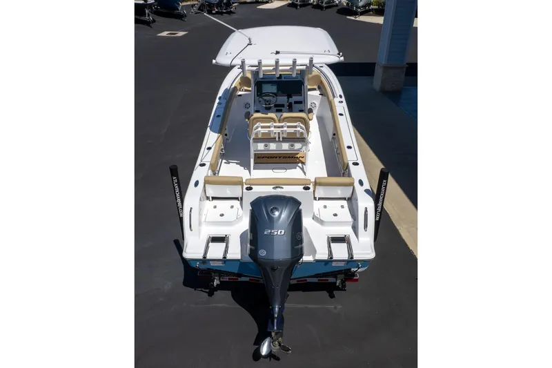 Slide: The Image of 2026 Sportsman Heritage 231 Center Console boat with powerful outboard motor. - 6