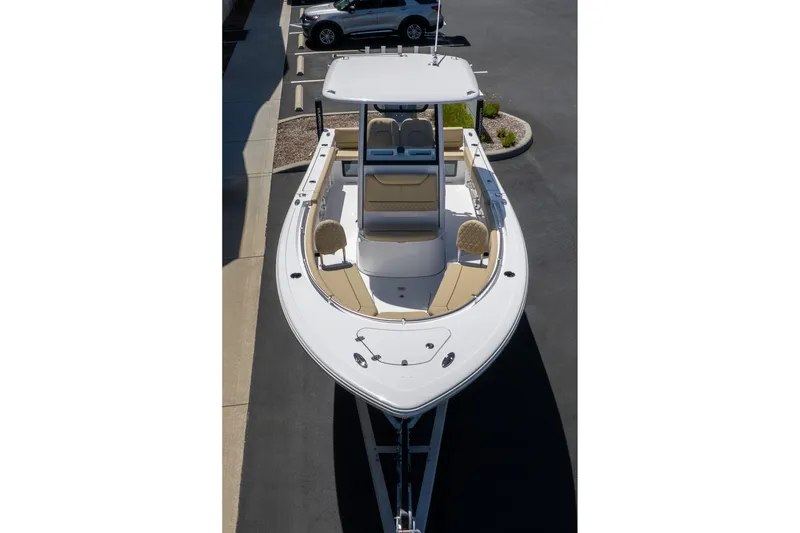 Slide: The Image of 2026 Sportsman Heritage 231 Center Console boat, aerial view, parked on pavement. - 9