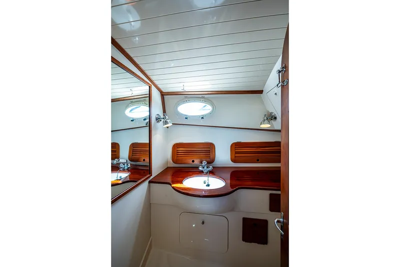 Slide: The Image of Elegant wooden interior of 2001 Hinckley Picnic Boat 36 Classic bathroom. - 17