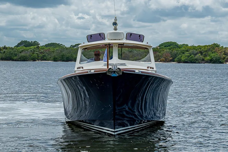 Slide: The Image of 2001 Hinckley Picnic Boat 36 Classic cruising on a serene lake. - 3