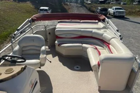 Slide: The Image of 2004 Bennington 2275LX pontoon boat with spacious seating and steering console. - 4