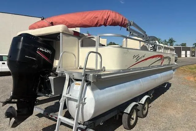 Slide: The Image of 2004 Bennington 2275LX pontoon boat on trailer with outboard motor and canopy. - 9