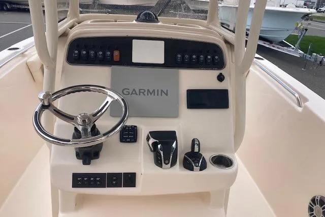 Slide: The Image of 2023 Grady-White Fisherman 236 boat dashboard with Garmin navigation system. - 4