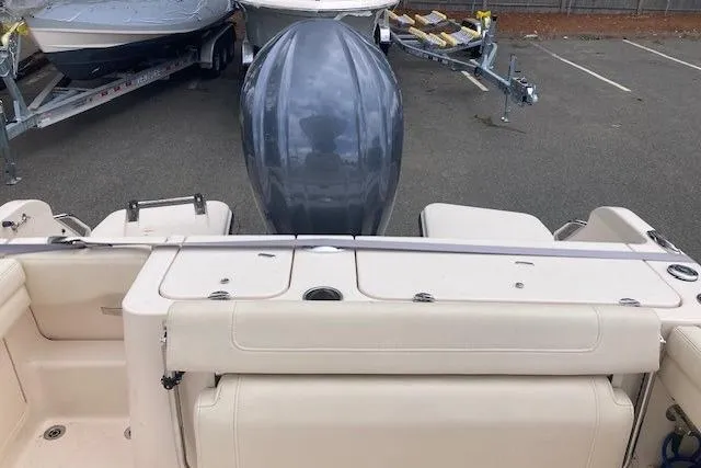 Slide: The Image of 2023 Grady-White Fisherman 236 boat with outboard motor in a parking lot. - 5