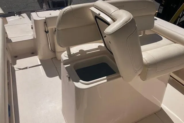 Slide: The Image of 2023 Grady-White Fisherman 236 boat interior with open storage compartment. - 8