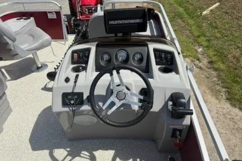 Slide: The Image of 2020 Bennington SV 188 SFV boat dashboard with steering wheel and Humminbird display. - 8