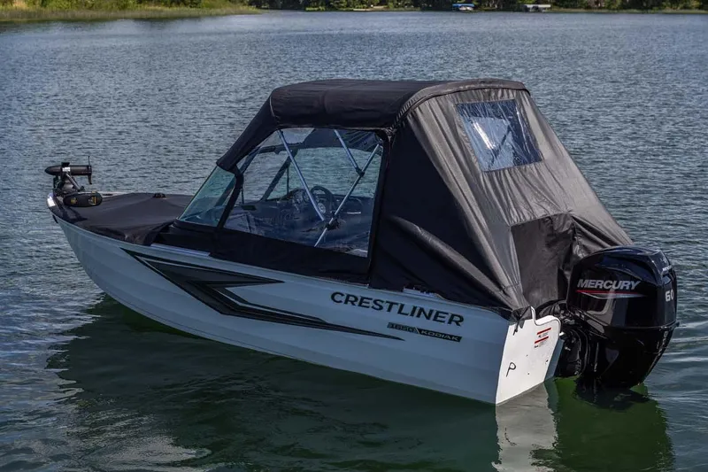 Slide: The Image of Manufacturer Provided Image: 2026 Crestliner 1650 Kodiak WT boat on calm lake with Mercury outboard motor. - 3