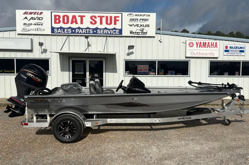 The Image of 2026 Vexus Defender 189 boat displayed at dealership, featuring Yamaha outboard motor. - 1