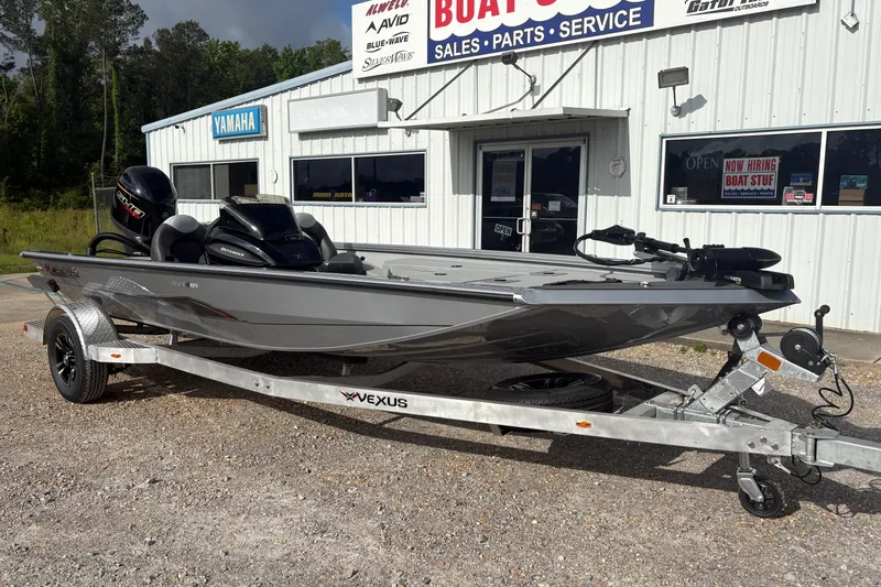 Slide: The Image of 2026 Vexus Defender 189 boat on trailer outside dealership. - 5