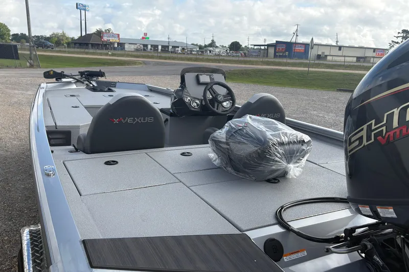 Slide: The Image of 2026 Vexus Defender 189 boat with modern design and powerful engine, parked outdoors. - 7