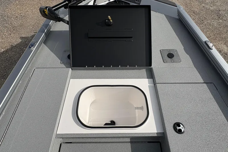 Slide: The Image of 2026 Vexus Defender 189 boat deck with open storage compartment. - 9