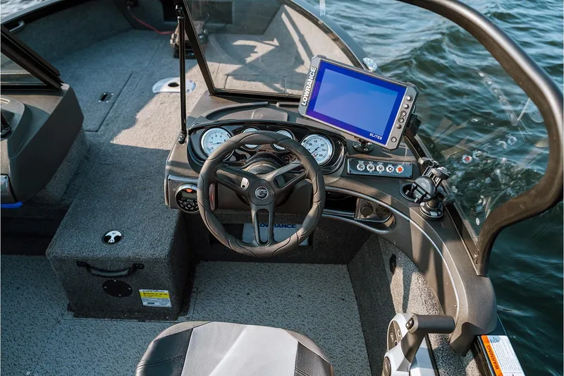 Slide: The Image of Manufacturer Provided Image: 2026 Crestliner 1750 Hawk WT boat dashboard with steering wheel and navigation system. - 3
