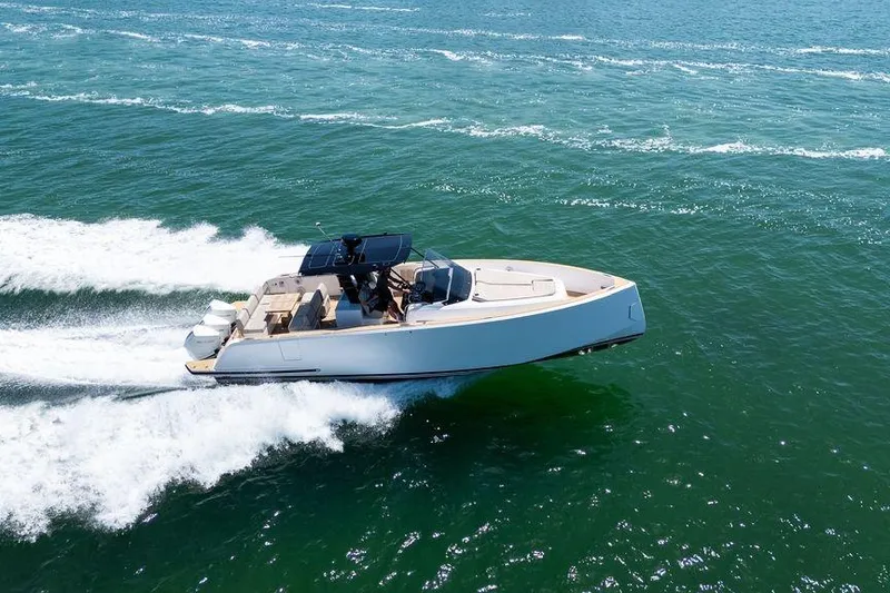 Slide: The Image of 2022 Pardo Yachts 38 cruising on open water, leaving a wake behind. - 10