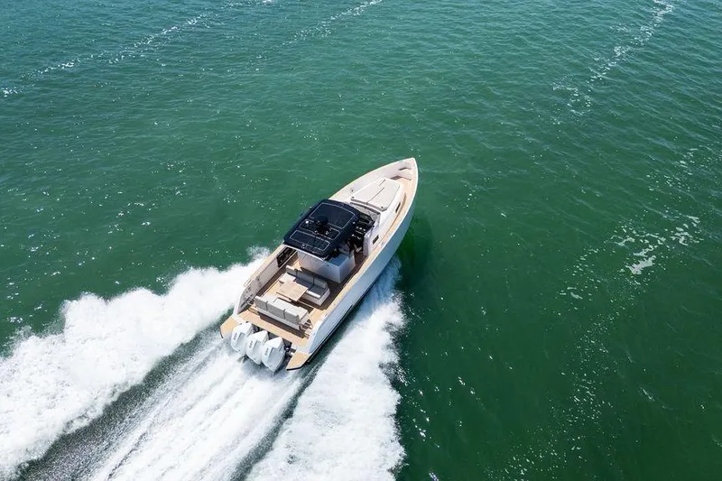 Slide: The Image of 2022 Pardo Yachts 38 cruising on open water under a clear sky. - 11