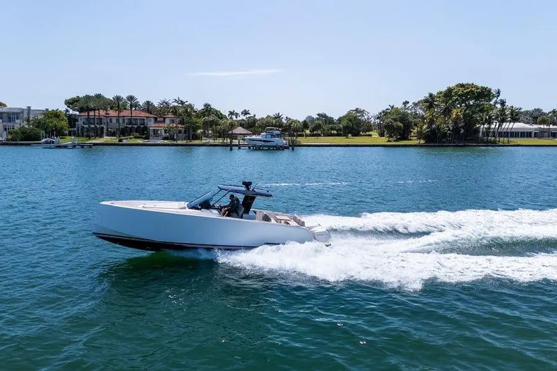 Slide: The Image of Overhead view of 2022 Pardo Yachts 38 on green water. - 12
