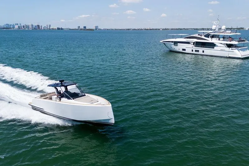 Slide: The Image of 2022 Pardo Yachts 38 cruising on calm green waters, showcasing sleek design and luxury features. - 13