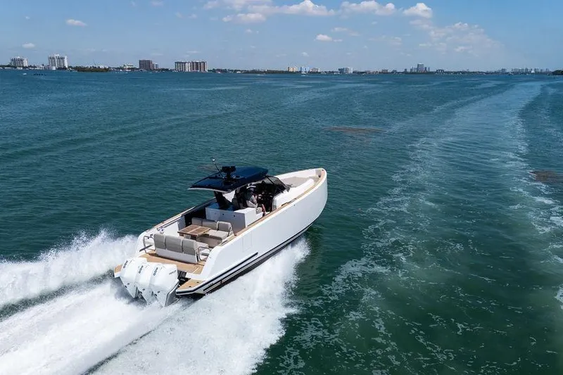 Slide: The Image of 2022 Pardo Yachts 38 cruising on calm waters near a city skyline. - 19