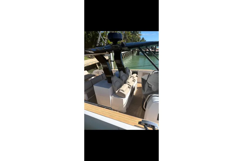 Slide: The Image of 2022 Pardo Yachts 38 with sleek design and luxurious seating on deck. - 2