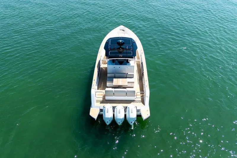 Slide: The Image of Interior of 2022 Pardo Yachts 38, featuring modern wood finishes and compact design. - 23