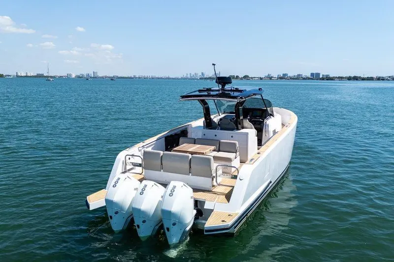 Slide: The Image of Pardo Yachts 38, 2022 model, featuring deck speakers and sleek design by the water. - 27
