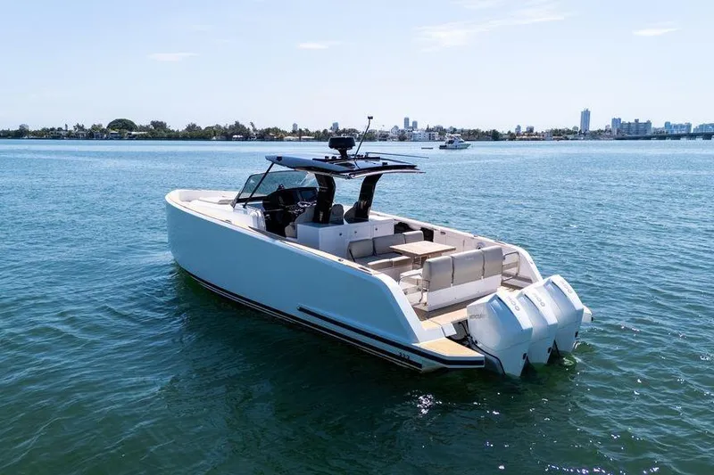 Slide: The Image of 2022 Pardo Yachts 38 on calm water, featuring sleek design and spacious deck. - 29