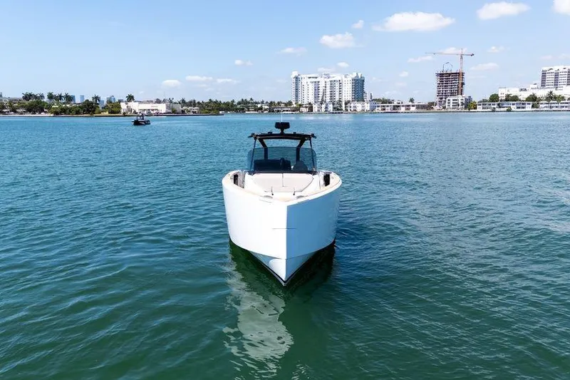 Slide: The Image of 2022 Pardo Yachts 38 on calm water with city skyline in background. - 31