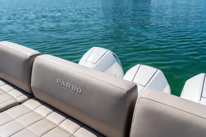 Slide: The Image of Triple Mercury outboard engines on 2022 Pardo Yachts 38, docked on calm water. - 43
