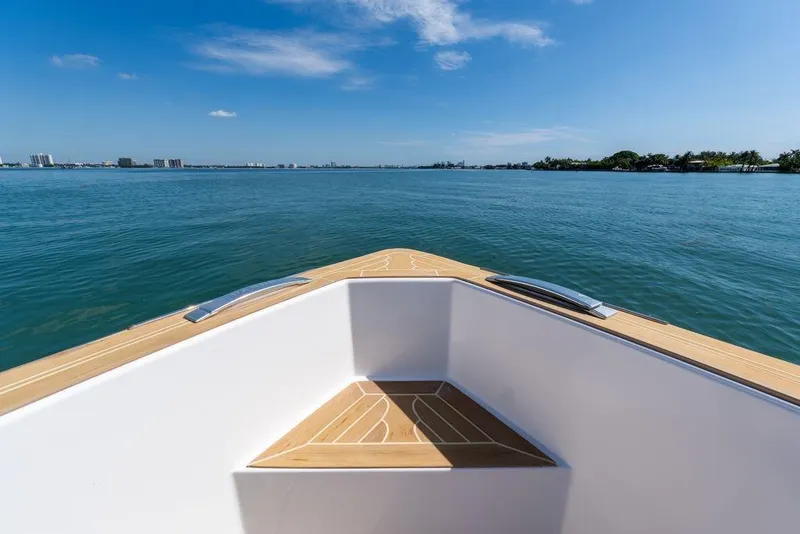 Slide: The Image of Luxurious seating area on 2022 Pardo Yachts 38, overlooking serene waters and distant shoreline. - 48