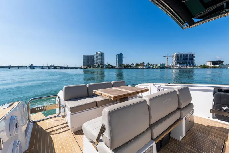 Slide: The Image of 2022 Pardo Yachts 38 cruising on open water near a larger yacht. - 5